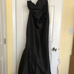 Black strapless gown with jet beads.